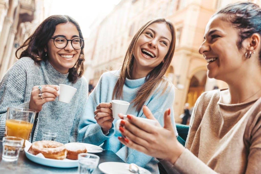 Friend group enjoying street food as an idea for an affordable staycation idea.