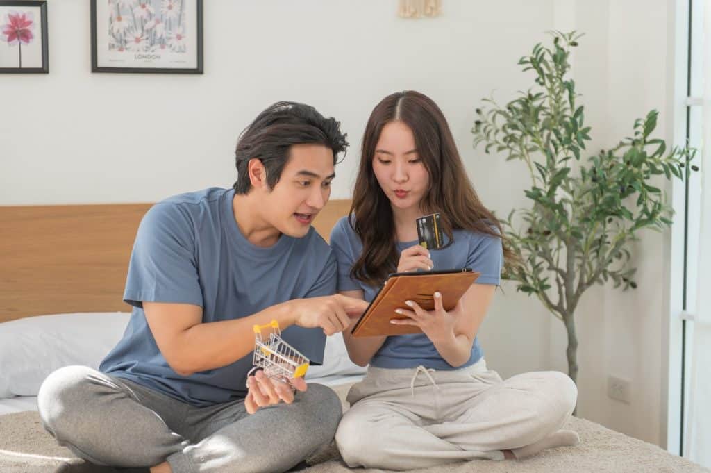 A family reviewing their household budget on a tablet, reflecting how the best budgeting apps 2025 adapt to different lifestyles and financial needs.