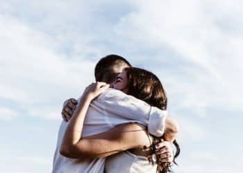 man and woman hugging each other photography