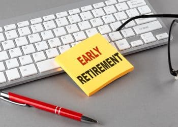 Sticky note with “Early Retirement” text on a keyboard, representing planning for how to retire early.