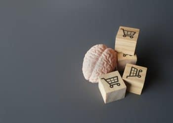 Brain and shopping icons symbolizing psychology of how to stop splurging money.